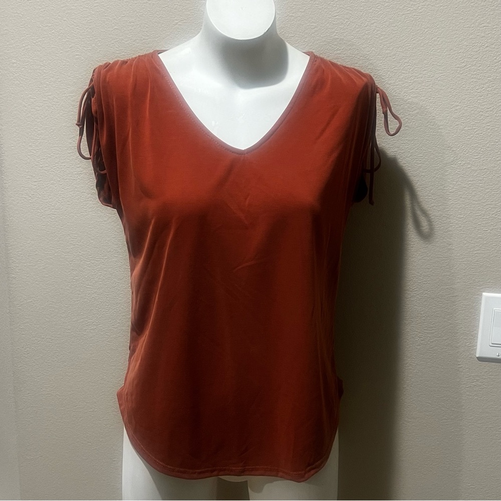 Green envelope orange stretchy top